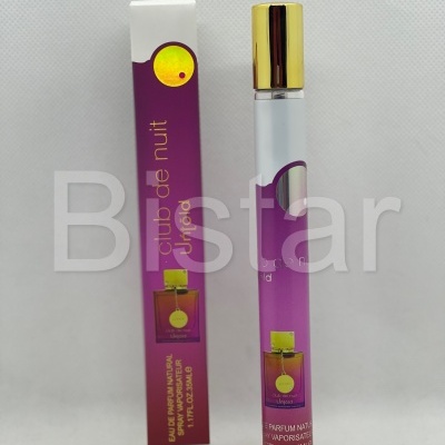 Frasco e caixa de eau de parfum natural club de nuit Untold roxa e dourada