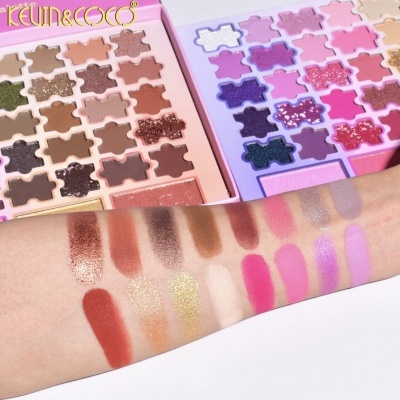 Paletas de sombras KEVIN&COCO com várias cores e amostras de cor num braço
