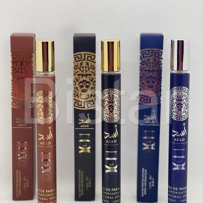 Três frascos de perfume ASAD com caixas castanha, preta e azul, detalhes dourados e tampas metálicas.