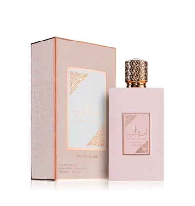 Frasco e embalagem de perfume rosa claro com detalhes dourados