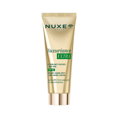 Creme facial Nuxe Nuxuriance Ultra em bisnaga dourada com tampa dourada e texto verde e preto