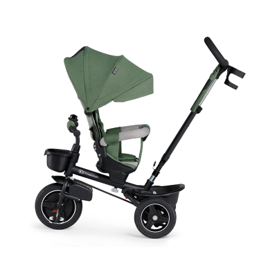 Triciclo infantil com tecido verde e estrutura preta, visto de lado