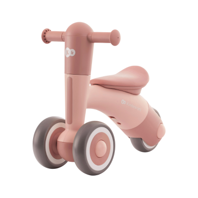 Triciclo infantil rosa em fundo branco.