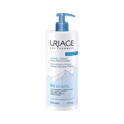 Frasco de creme de limpeza branco com doseador azul da marca Uriage