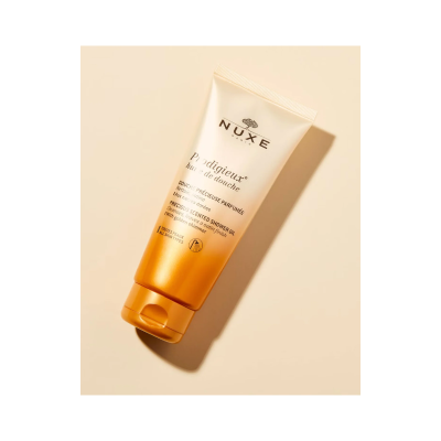 Frasco tubo dourado e branco de óleo de duche NUXE Prodigieux
