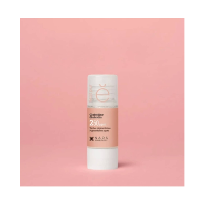 Produto cosmético com rótulo cor de pêssego e texto em fundo rosa