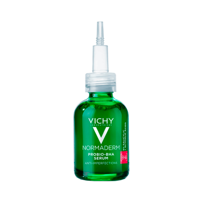 Frasco verde de vidro de soro facial Vichy Normaderm com tampa dosadora branca.