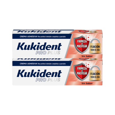 Caixas de creme adesivo Kukident Pro Plus para próteses dentárias com rótulos azul, branco e laranja.