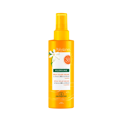 Frasco amarelo de spray solar Klorane Polysianes SPF 30 com rótulo branco e flor