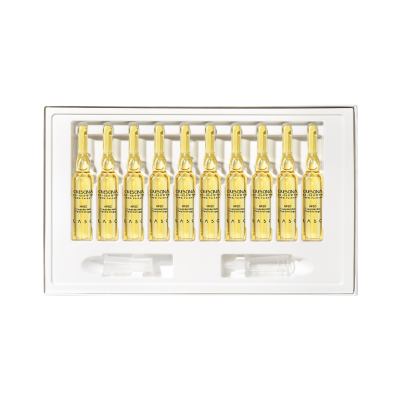 Conjunto de 10 ampolas de vidro com líquido amarelo em caixa branca