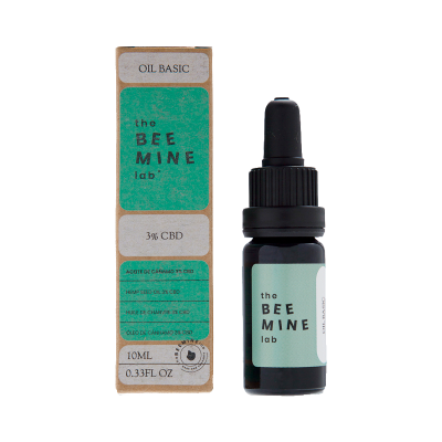Frasco de óleo com conta-gotas e embalagem com rótulo verde claro da marca the BEE MINE lab