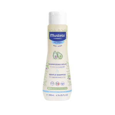 Frasco de champô suave Mustela para bebé com rótulo bege e detalhes verdes
