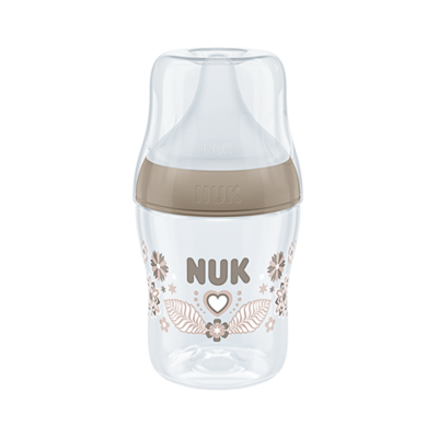 Mamadeira transparente NUK com tampa castanha e decoração floral