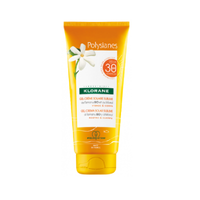 Frasco amarelo de gel-creme solar Polysianes Klorane com FPS 30 e flores brancas na embalagem