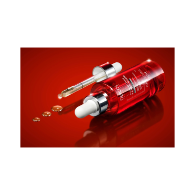 Frasco vermelho com conta-gotas e gotas de líquido no fundo vermelho