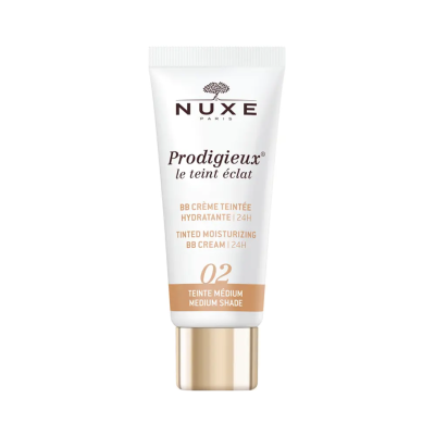Creme hidratante com cor NUXE Paris em tubo branco e dourado