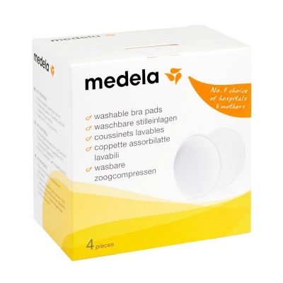 Embalagem branca e amarela de discos laváveis para soutien Medela com texto em várias línguas