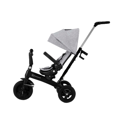 Triciclo infantil preto com assento e capota cinzentos e três rodas