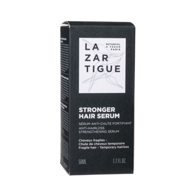 Caixa preta de sérum para cabelo com texto branco da marca LAZARTIGUE