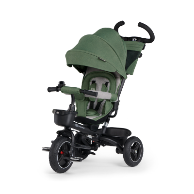 Triciclo verde para crianças com estrutura preta e acessórios adicionais