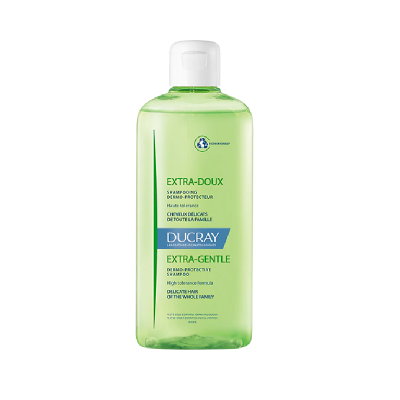 Frasco verde claro de shampoo DUCRAY Extra-Doux Extra-Gentle com tampa branca