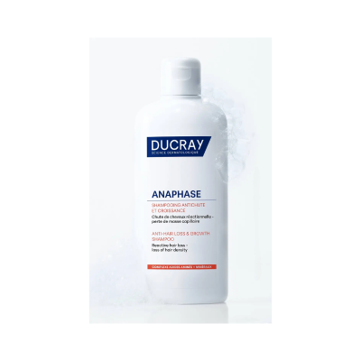Frasco branco de shampoo Ducray Anaphase com espuma ao lado