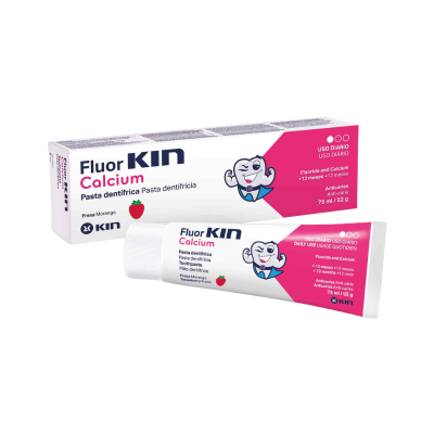 Creme dentífrico Fluor Kin Calcium sabor morango em embalagem branca e rosa com imagem de molar personificado