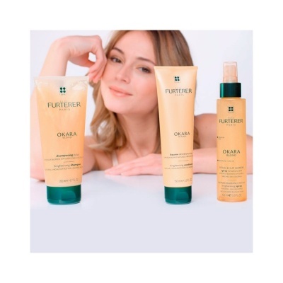 Três produtos Rene Furterer OKARA com mulher ao fundo