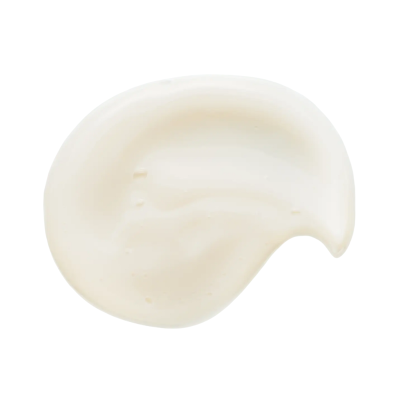 Pingo de creme branco com textura suave sobre fundo branco