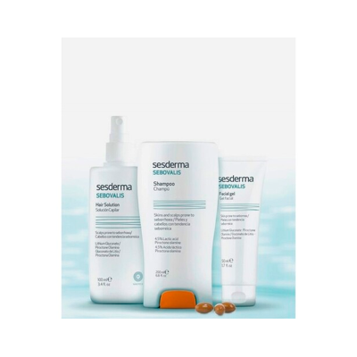 Três produtos Sesderma SEBOVALIS para cabelo e rosto em fundo azul claro