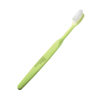 Escova de dentes verde com cerdas brancas