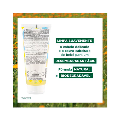 Embalagem branca de produto para cabelo com texto explicativo em português e fundo floral laranja e verde