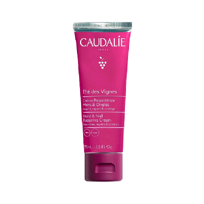 Tubo de creme para mãos e unhas Caudalie cor rosa com tampa roxa
