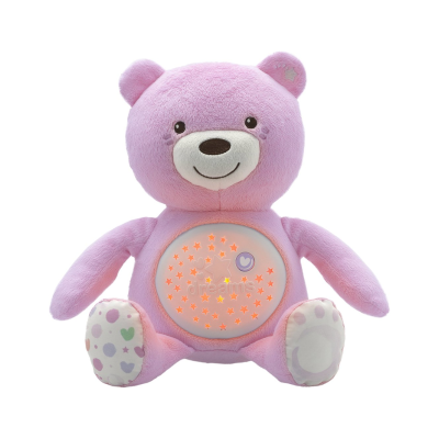 Urso de peluche rosa com ventres iluminado com estrelas e palavra dreams.