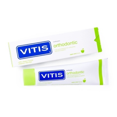 Creme dentário VITIS orthodontic embalagem branca com detalhes verdes e azuis