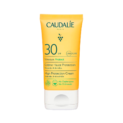 Tubo amarelo de creme com tampa branca e texto CAUDALÍE SPF 30