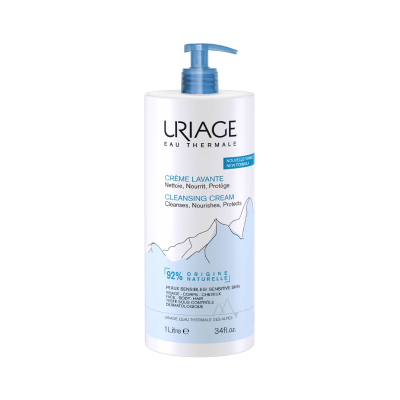 Frasco branco com tampa azul de dosagem do produto Uriage Eau Thermale Crème Lavante Cleansing Cream