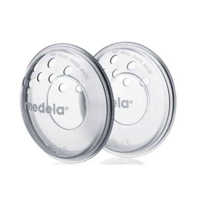 Dois discos transparentes em plástico com orifícios e texto medela®