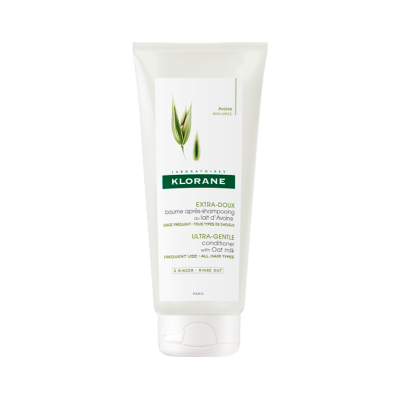 Condicionador Klorane em tubo branco com imagem de aveia e texto em verde e preto
