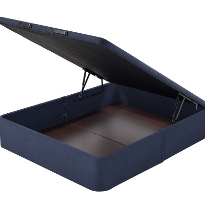 Base de cama azul escura com tampa levantada mostrando arrumação interna