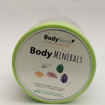 Frasco Body Minerals com tampa verde claro e rótulo branco com texto e ilustrações de cristais