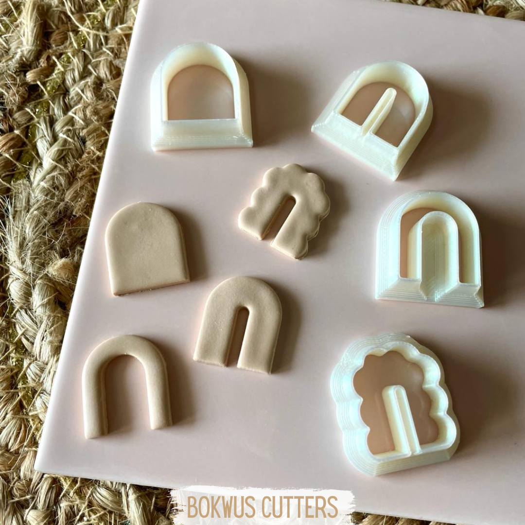 Conjunto de 4 cortadores - BC037 Cortadores de massa em forma de arco e portal em plástico branco com massa cortada