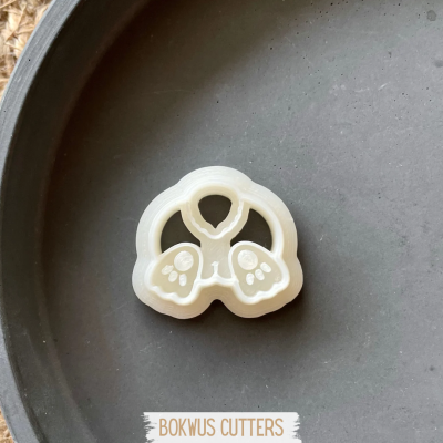 Cortador de biscoitos em forma de patas de animal branco