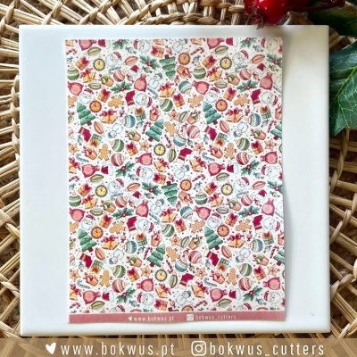 Folha decorativa com padrão natalício colorido com vários elementos festivos