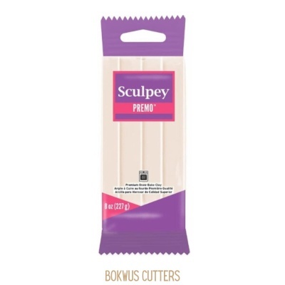 Massa de modelar creme Sculpey PREMO® embalada com detalhes roxos.