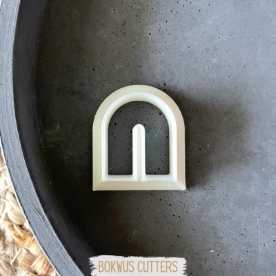 Cortador plástico branco BOKWUS CUTTERS em superfície cinzenta escura