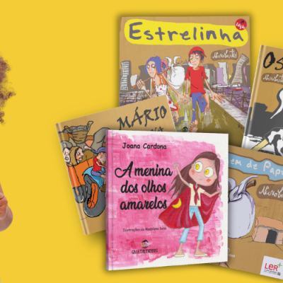 Menina lendo livro amarelo com livros infantis coloridos ao lado