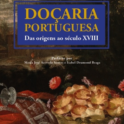 Capa do livro 'DOÇARIA PORTUGUESA' com cesta de pão e flores numa mesa.