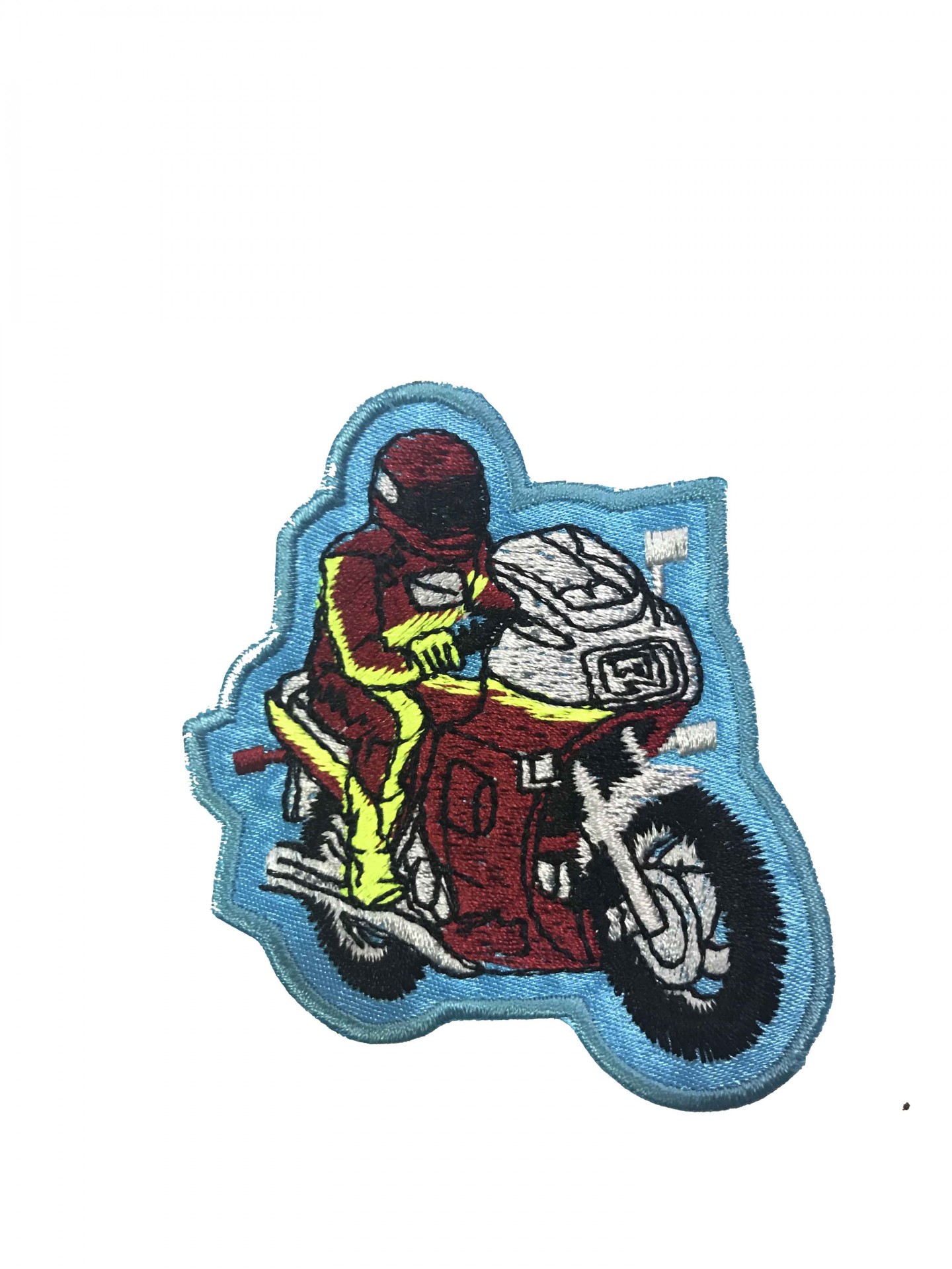 Patch bordado de motociclista em mota vermelha com fundo azul