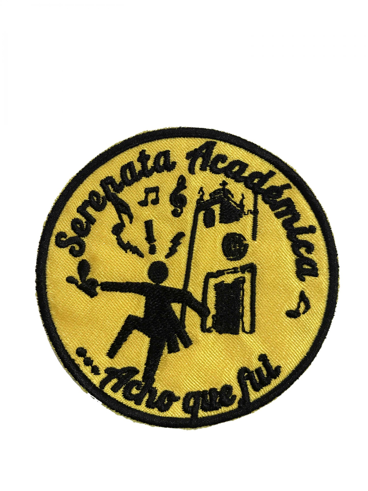 Emblema redondo amarelo com texto e figura preta de pessoa com guizos